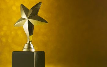 close-up-trophy-against-gold-background