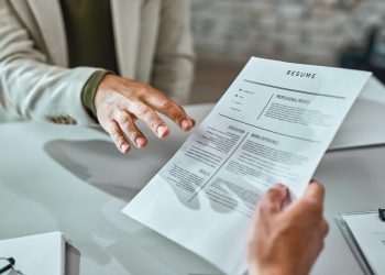 closeup-candidate-giving-his-cv-while-applying-job-office